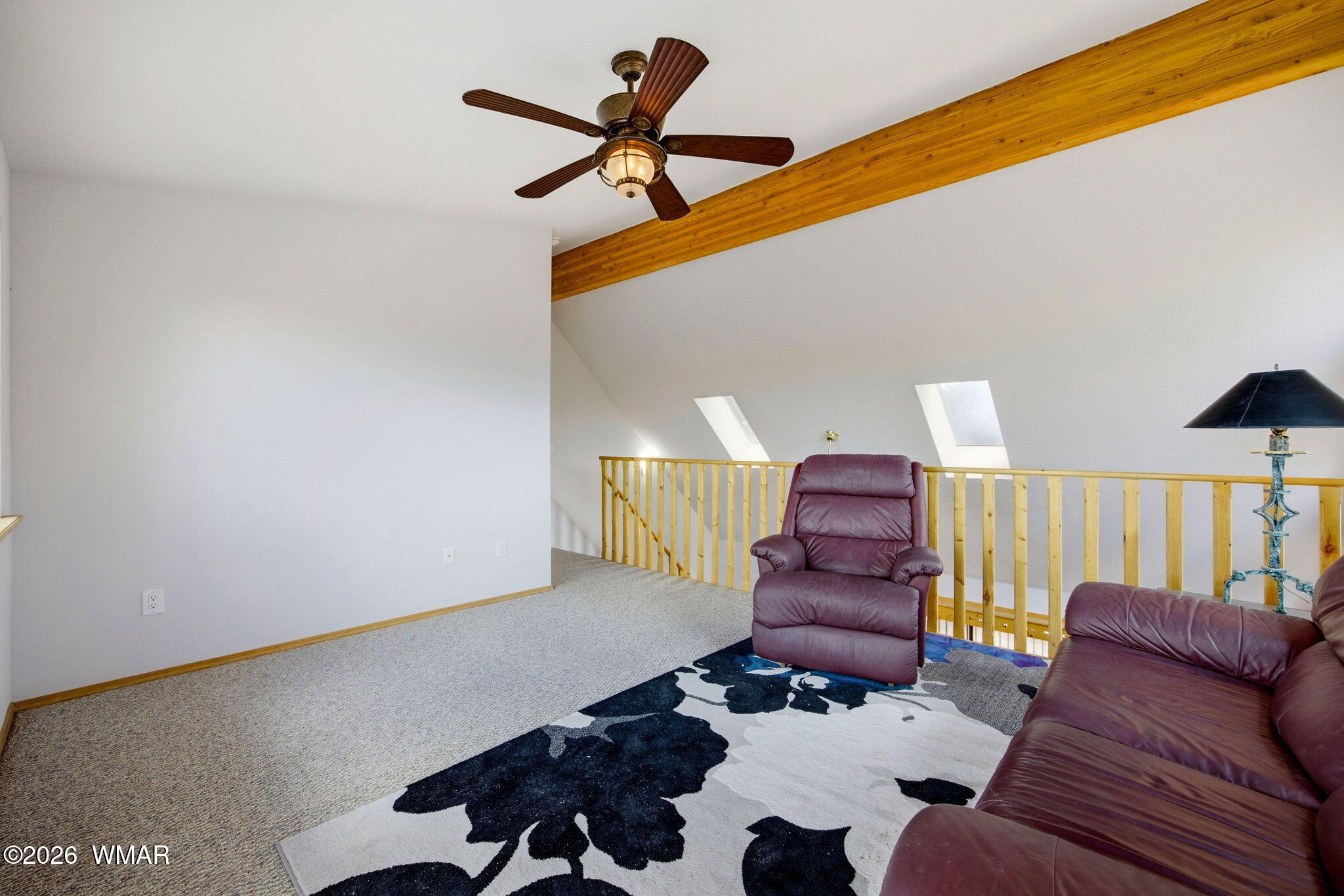 2806 Sky Hawk Drive Overgaard, AZ 85933 - Photo 22 of 43 a living room with furniture and a lamp
