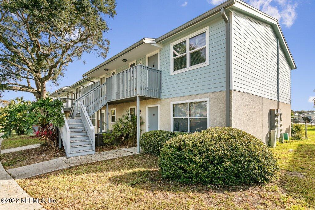 700 West Pope Road, Unit A6 St. Augustine, FL 32080 - Photo 1 of 25 a view of a house with a yard