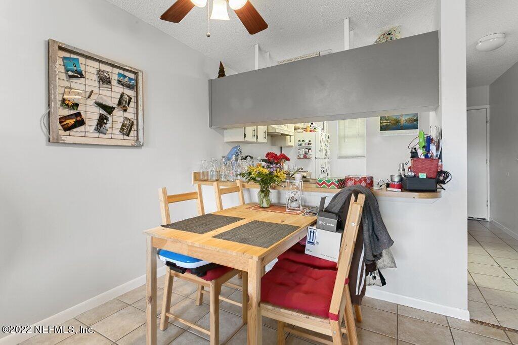 700 West Pope Road, Unit A6 St. Augustine, FL 32080 - Photo 11 of 25 a view of a dining room with furniture
