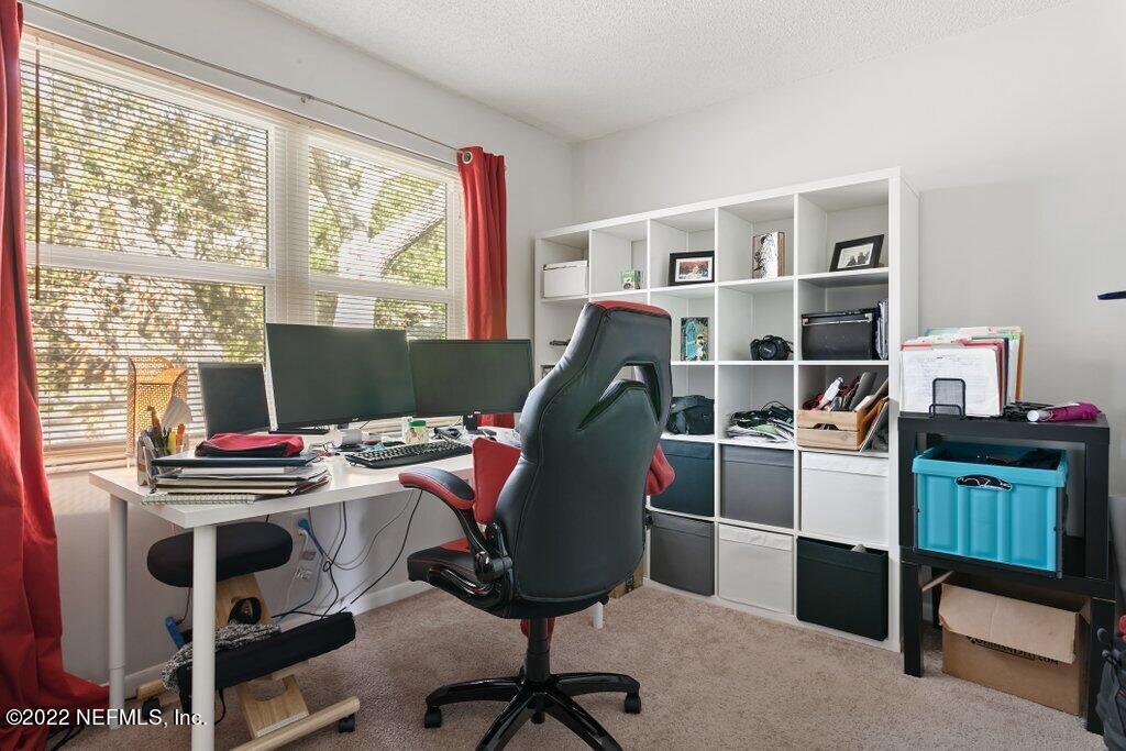 700 West Pope Road, Unit A6 St. Augustine, FL 32080 - Photo 15 of 25 a workspace with furniture and a window