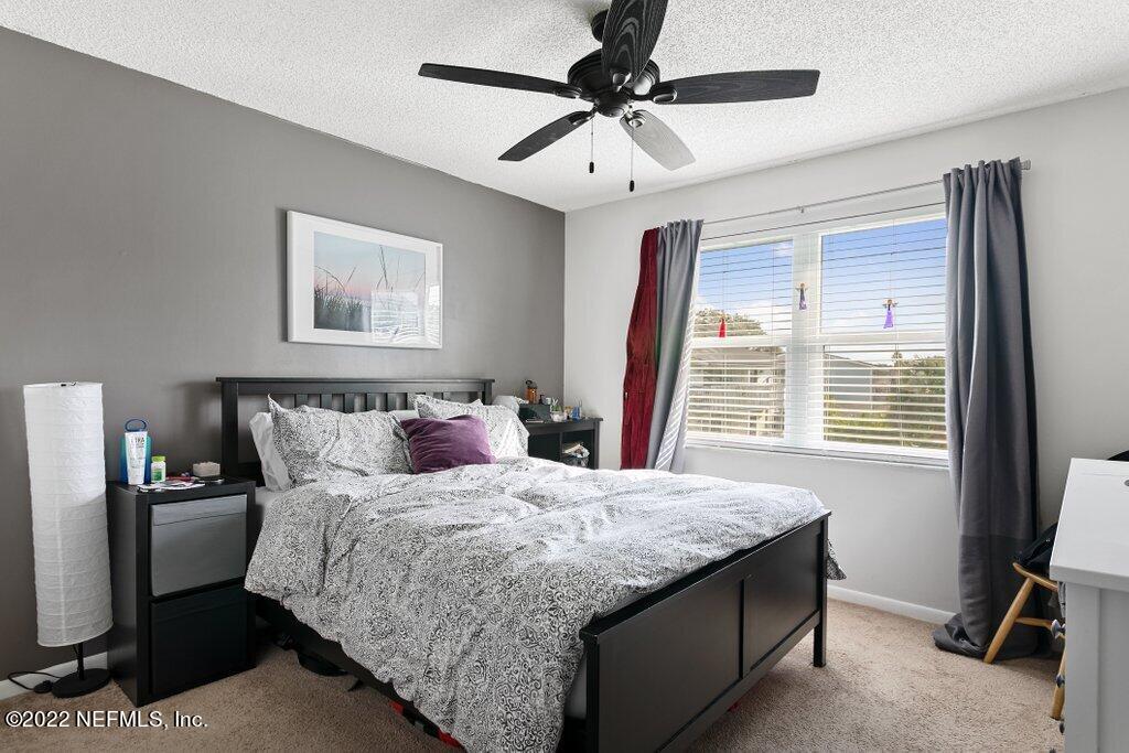 700 West Pope Road, Unit A6 St. Augustine, FL 32080 - Photo 17 of 25 a bedroom with a large bed and a window