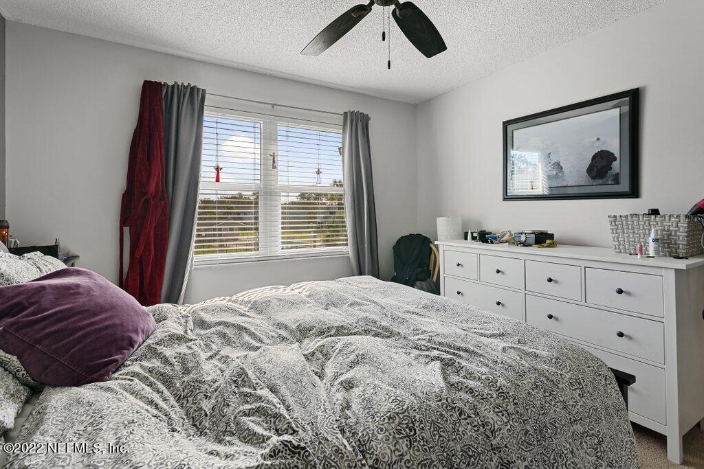700 West Pope Road, Unit A6 St. Augustine, FL 32080 - Photo 19 of 25 a bedroom with a large bed and a window