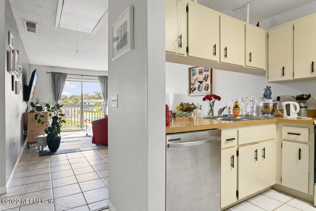 700 West Pope Road, Unit A6 St. Augustine, FL 32080 - Photo 20 of 25 a kitchen with a sink and cabinets