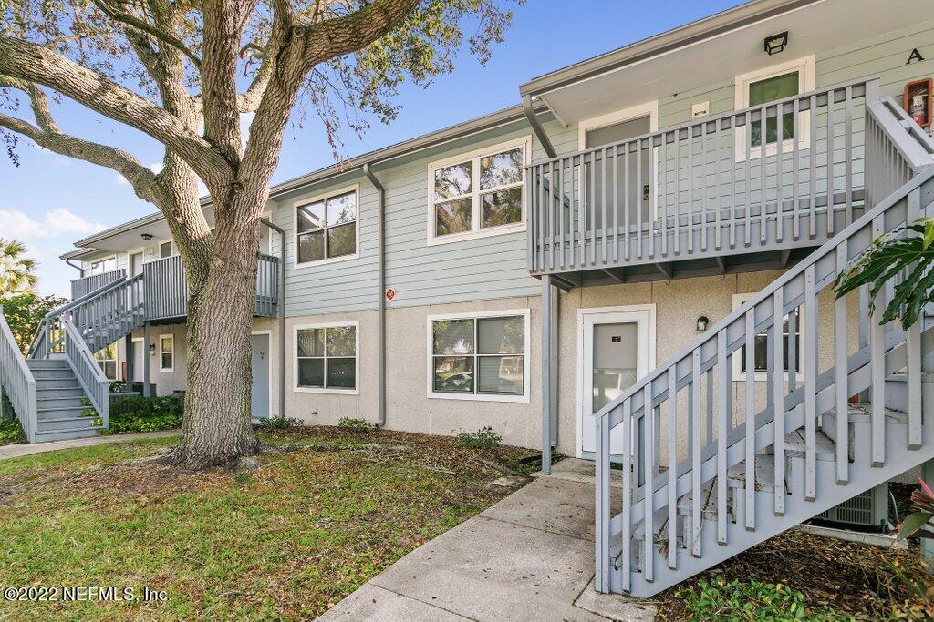 700 West Pope Road, Unit A6 St. Augustine, FL 32080 - Photo 2 of 25 a view of a house with wooden fence