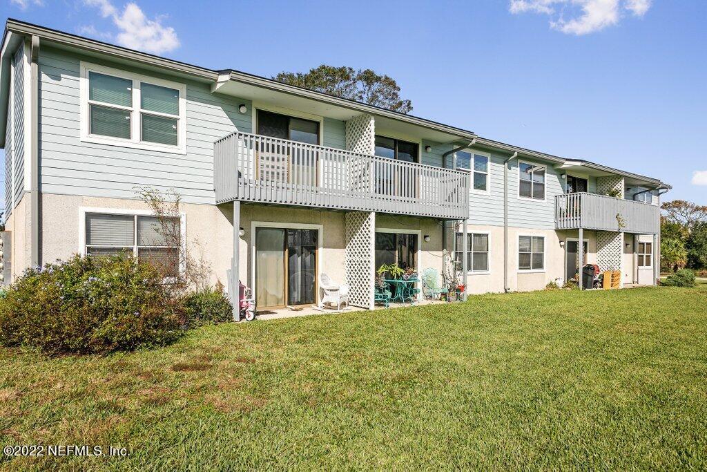 700 West Pope Road, Unit A6 St. Augustine, FL 32080 - Photo 21 of 25 a front view of a building with a garden