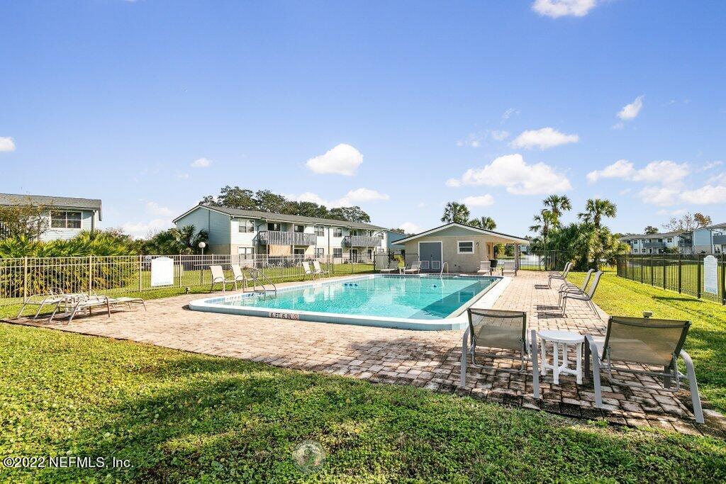 700 West Pope Road, Unit A6 St. Augustine, FL 32080 - Photo 23 of 25 a view of a house with a yard and sitting area