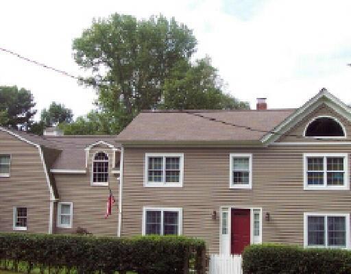 57 North Street Ridgefield, CT 06877 - Photo 1 of 1 a front view of a house with a yard