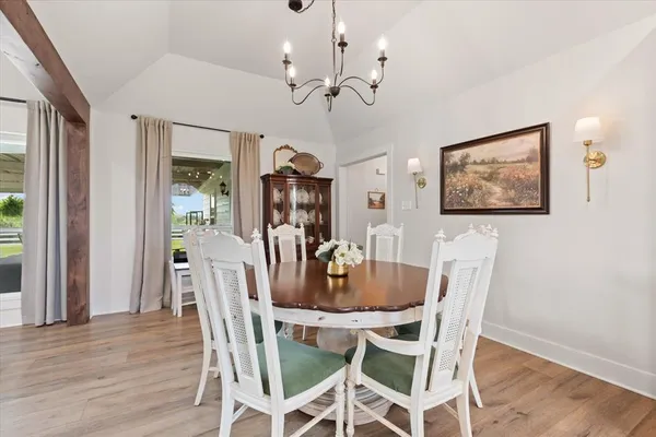 a dining room with furniture and window