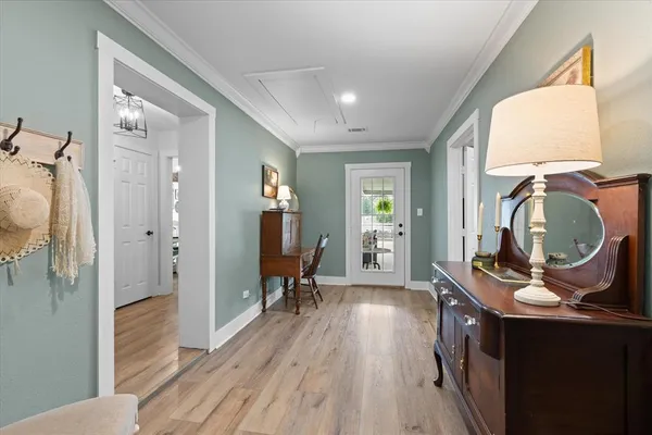 a view of living room and wooden floor