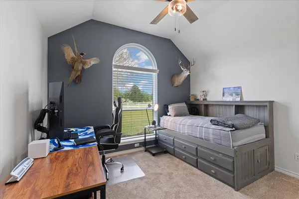 a bed room with a bed and a window