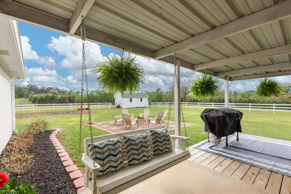 a view of a swimming pool with a patio