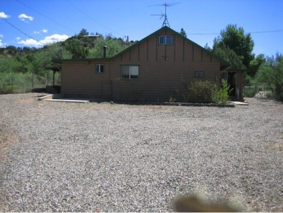 4263 Pima Way Rimrock, AZ 86335 - Photo 1 of 10 a front view of a house with a yard