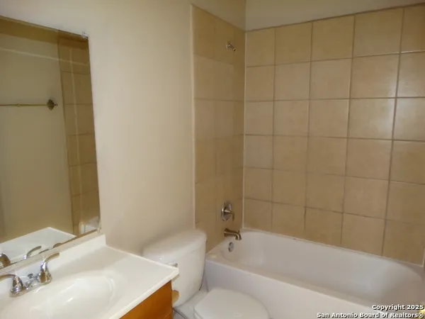 a bathroom with a sink and a bathtub