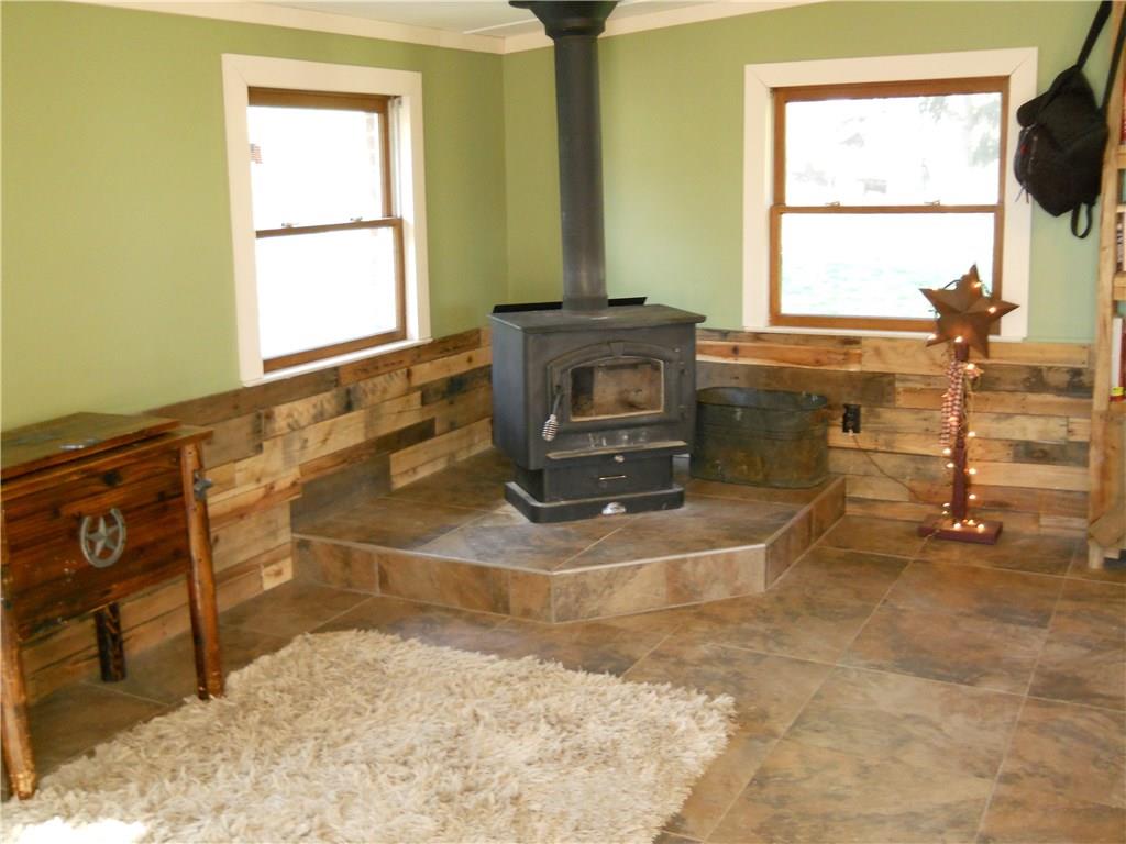 220 Moore Road Washington, PA 15301 - Photo 13 of 25 view of mud room w/new ceramic tiles and wood burner