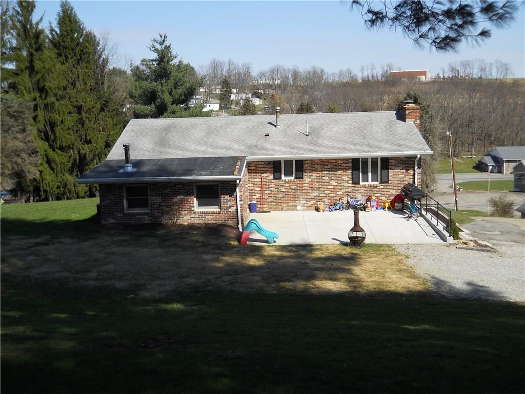 view from the South with new concrete Patio (24x18) and the Mud room
