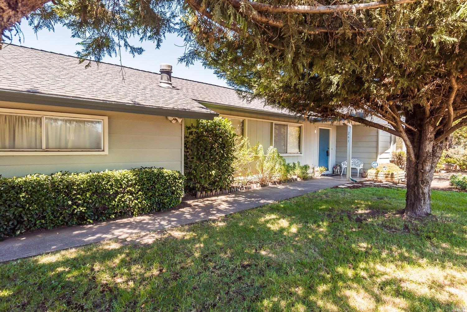 261 Pleasant Avenue Santa Rosa, CA 95403 - Photo 1 of 1 a front view of a house with garden