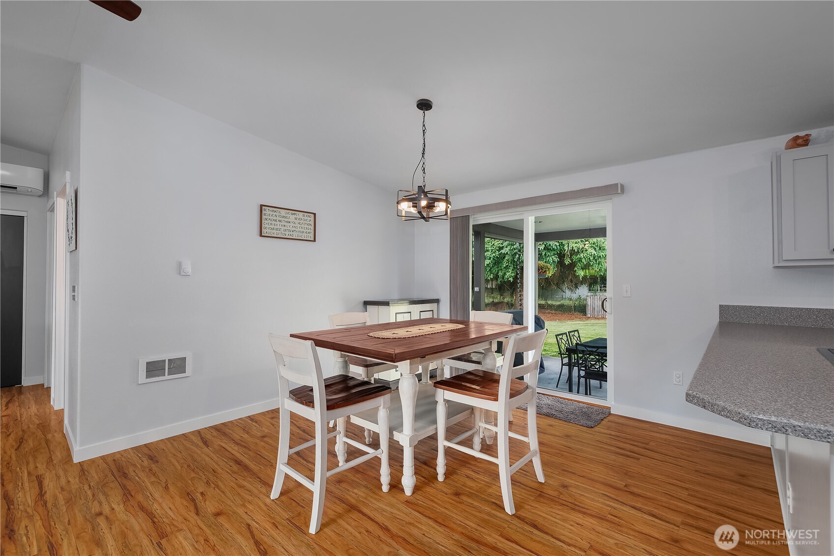 8336 178th Avenue Southwest Rochester, WA 98579 - Photo 16 of 39 a dining room with furniture window and wooden floor
