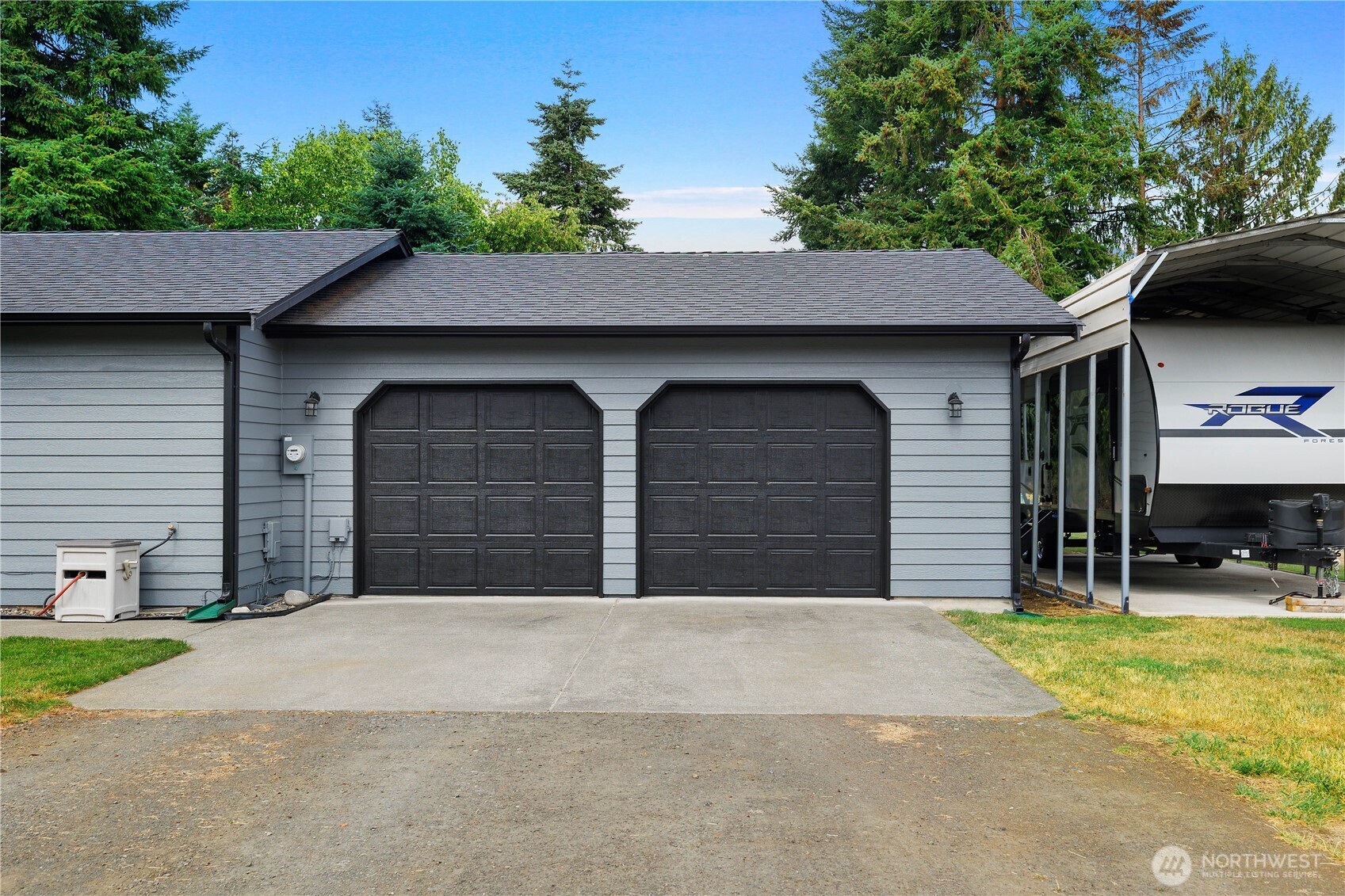 8336 178th Avenue Southwest Rochester, WA 98579 - Photo 22 of 39 a front view of a house with yard and garage