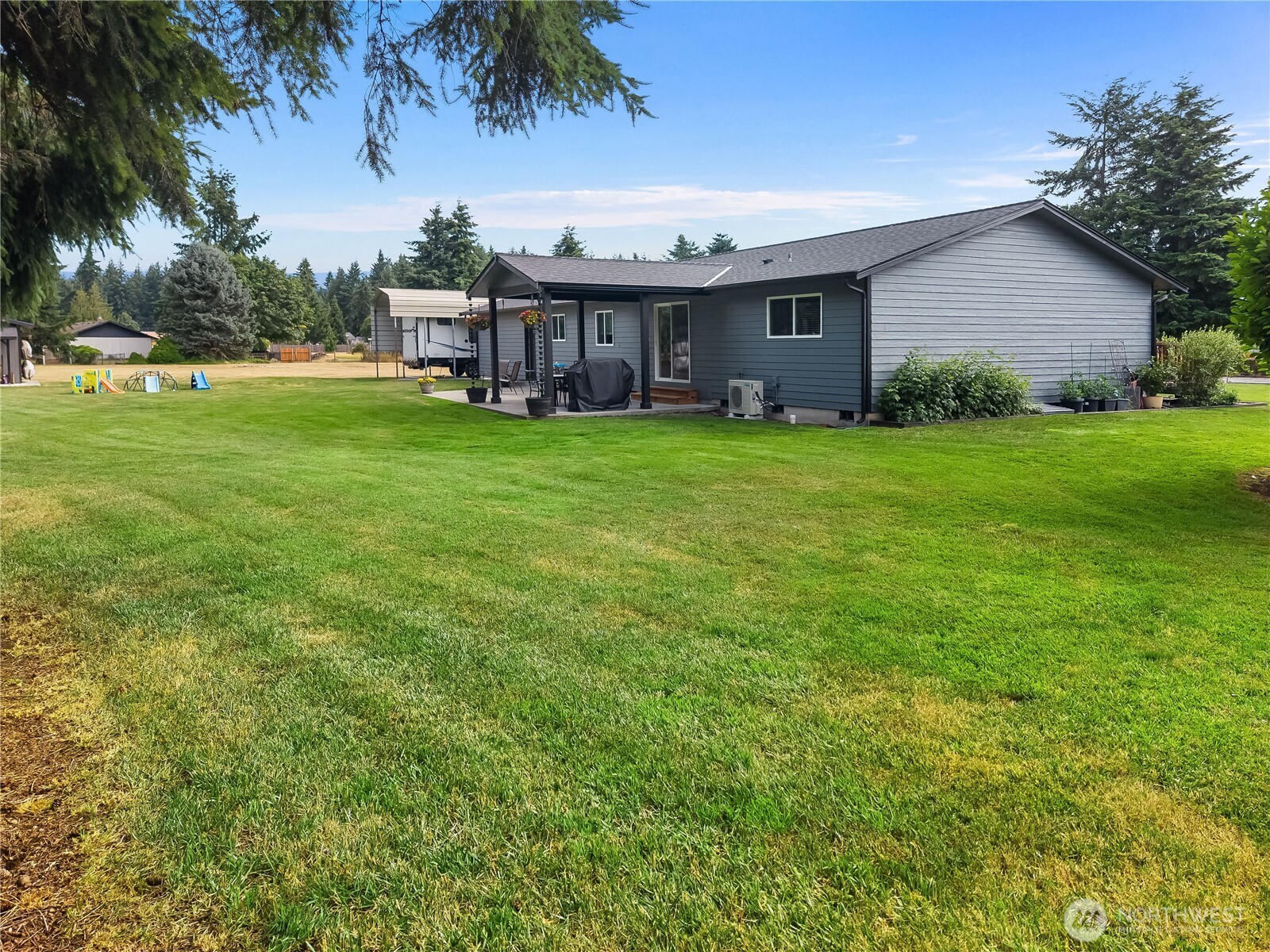 8336 178th Avenue Southwest Rochester, WA 98579 - Photo 29 of 39 a view of a house with a backyard