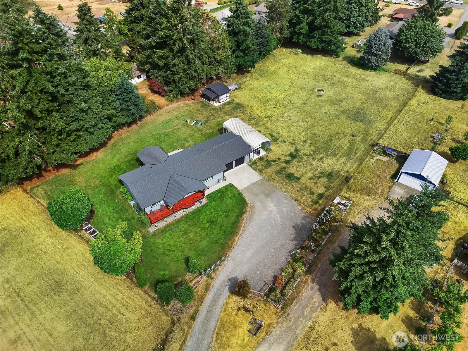 8336 178th Avenue Southwest Rochester, WA 98579 - Photo 37 of 39 an aerial view of a house with a yard