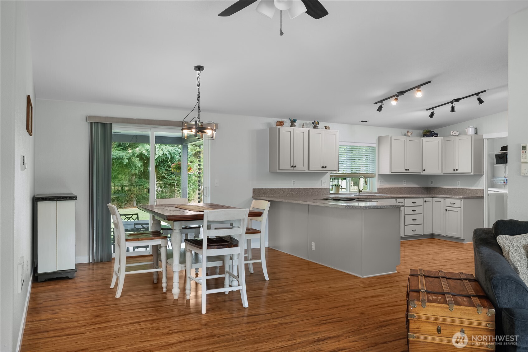 8336 178th Avenue Southwest Rochester, WA 98579 - Photo 6 of 39 a kitchen with stainless steel appliances a dining table chairs and wooden floor