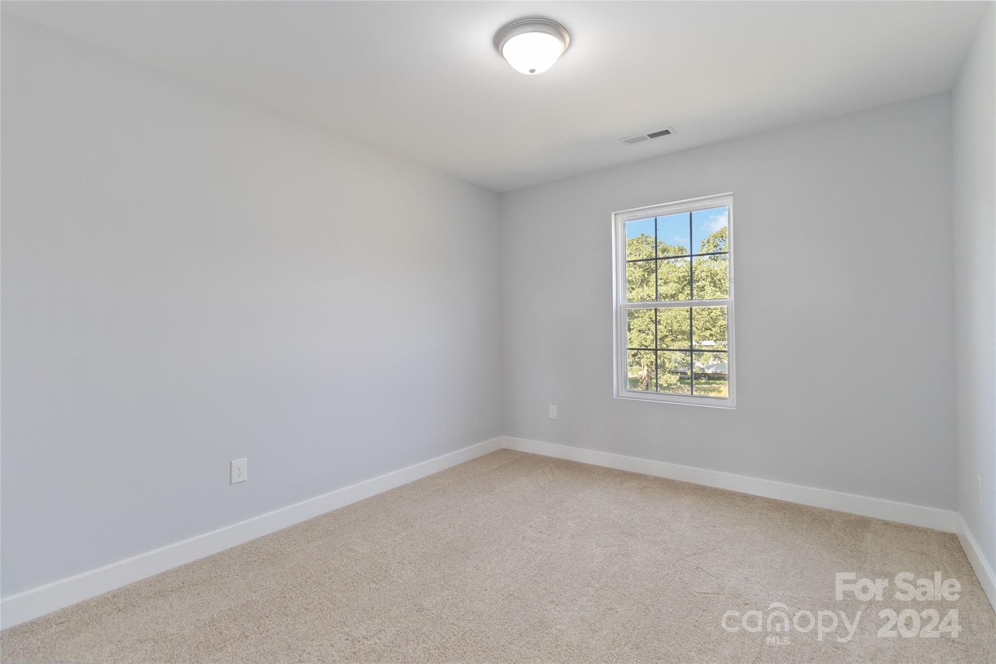 1030 Heath Helms Road Monroe, NC 28110 - Photo 17 of 30 an empty room with a window