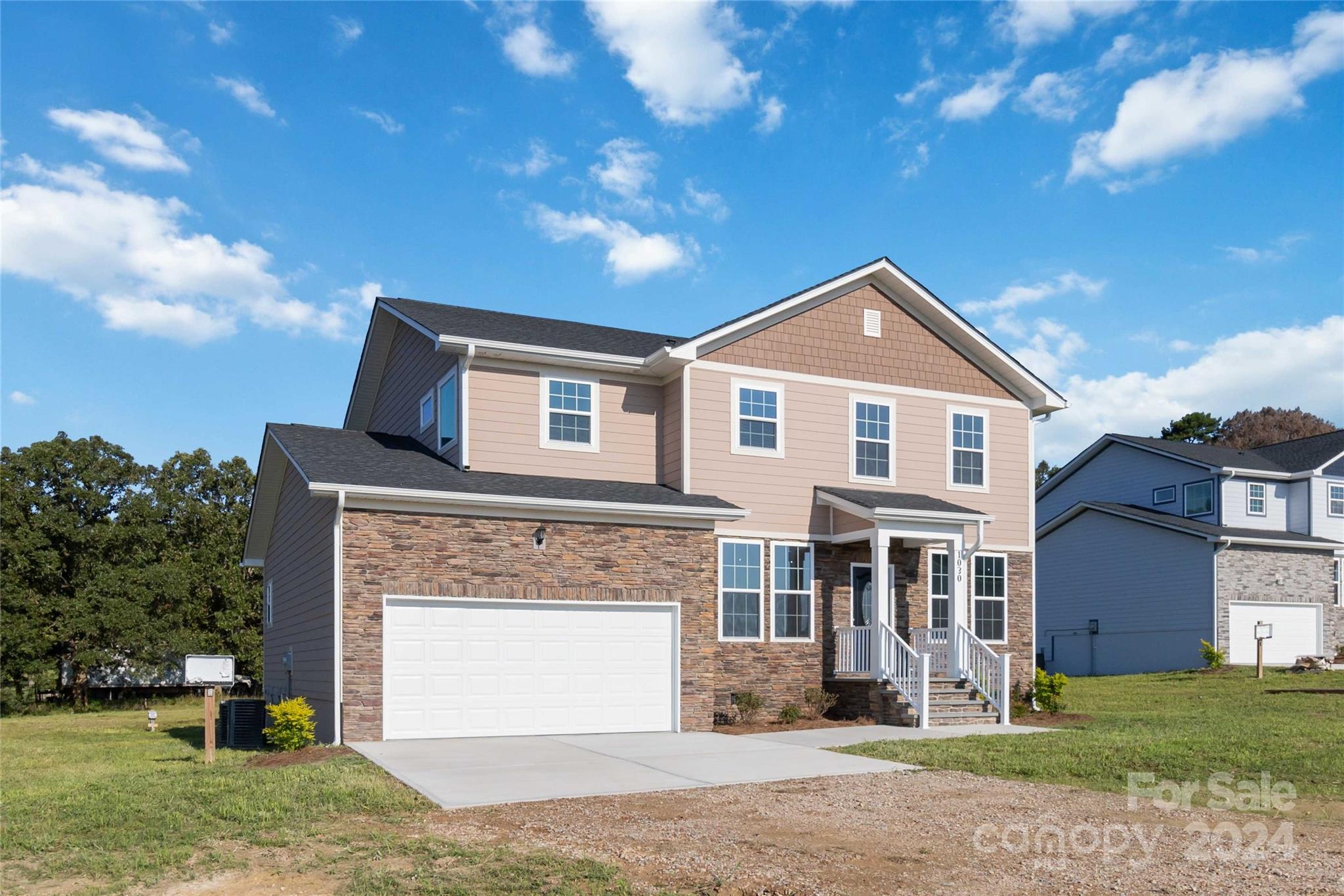 1030 Heath Helms Road Monroe, NC 28110 - Photo 2 of 30 a front view of a house with a garden and yard