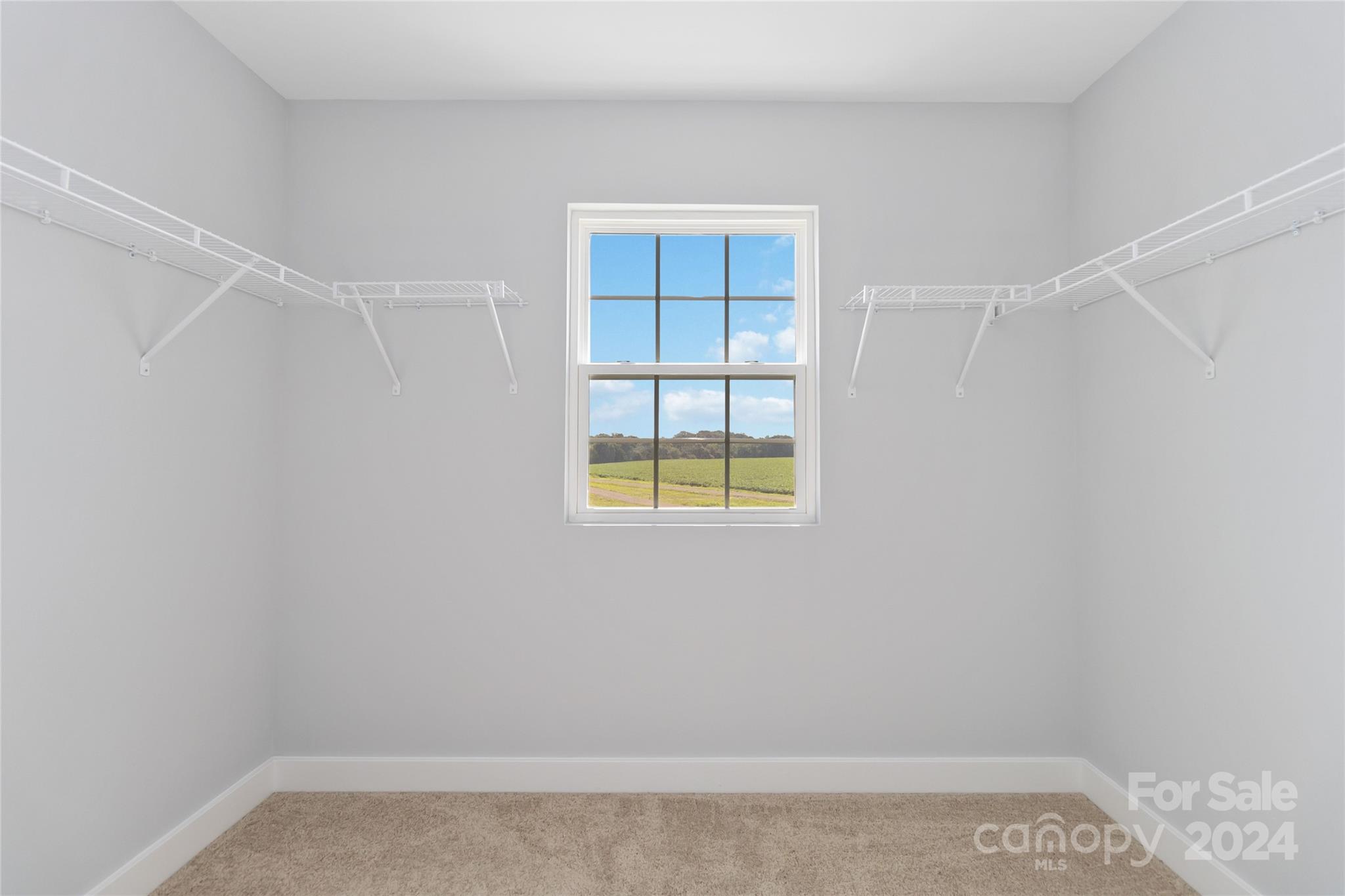 1030 Heath Helms Road Monroe, NC 28110 - Photo 22 of 30 a view of an empty room with a window and closet