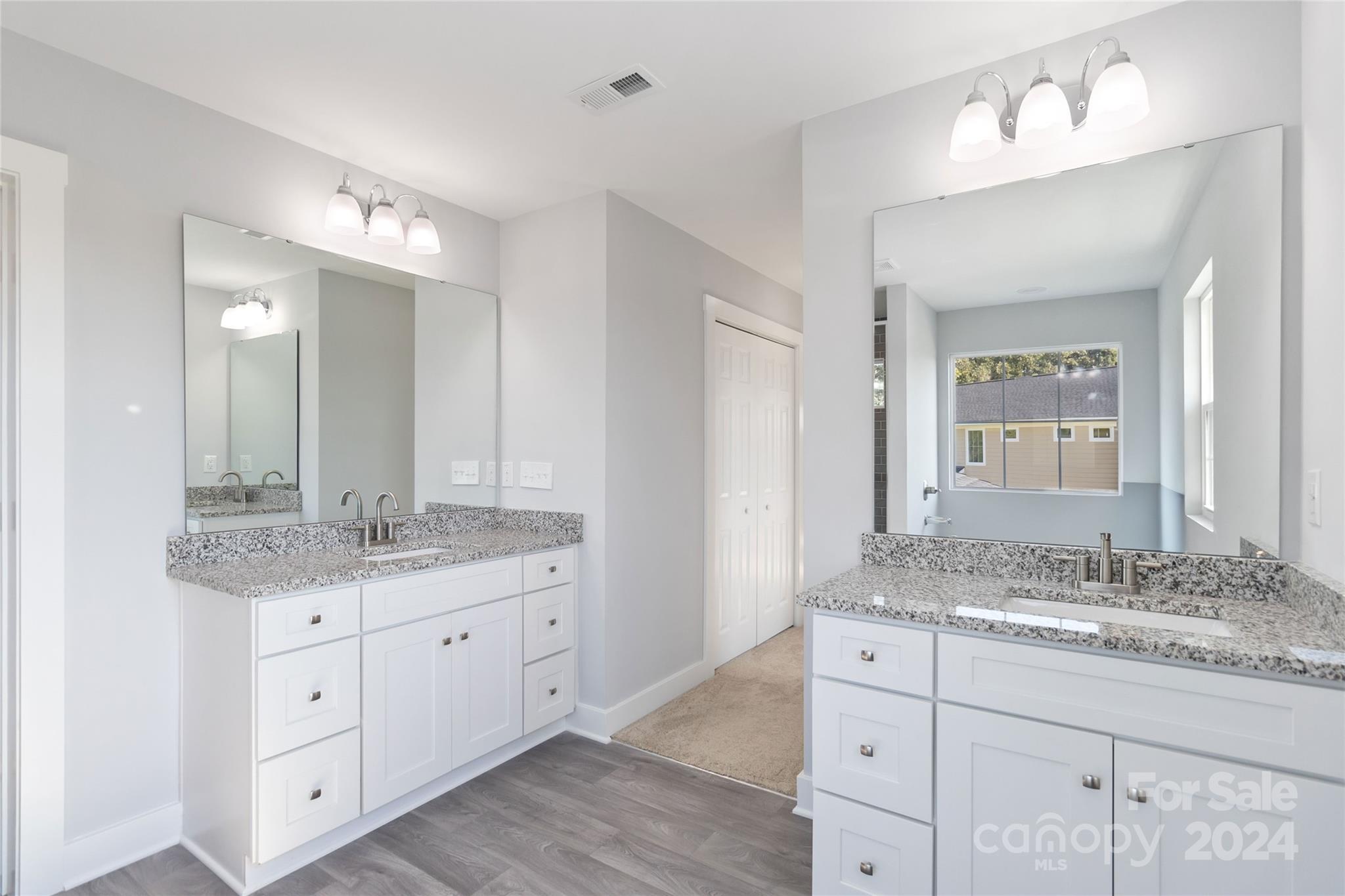 1030 Heath Helms Road Monroe, NC 28110 - Photo 25 of 30 a bathroom with a granite countertop sink double and mirror