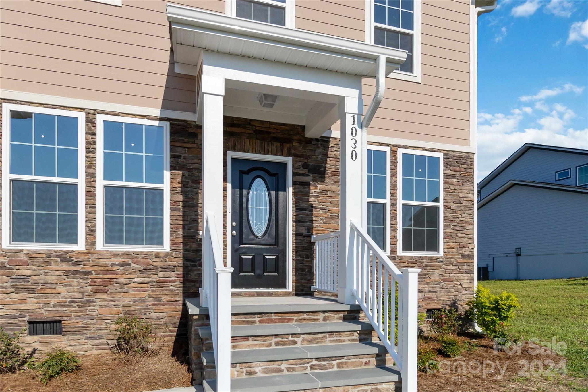 1030 Heath Helms Road Monroe, NC 28110 - Photo 4 of 30 a view of a brick house with large windows