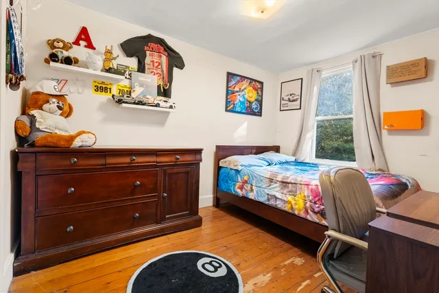 a bed room with a bed and a window