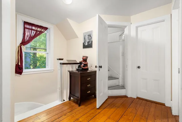 a bed room with a bed and a window