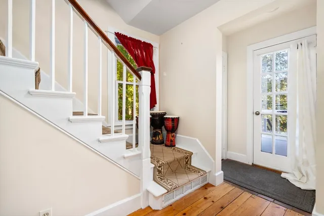 a living room with furniture and large windows