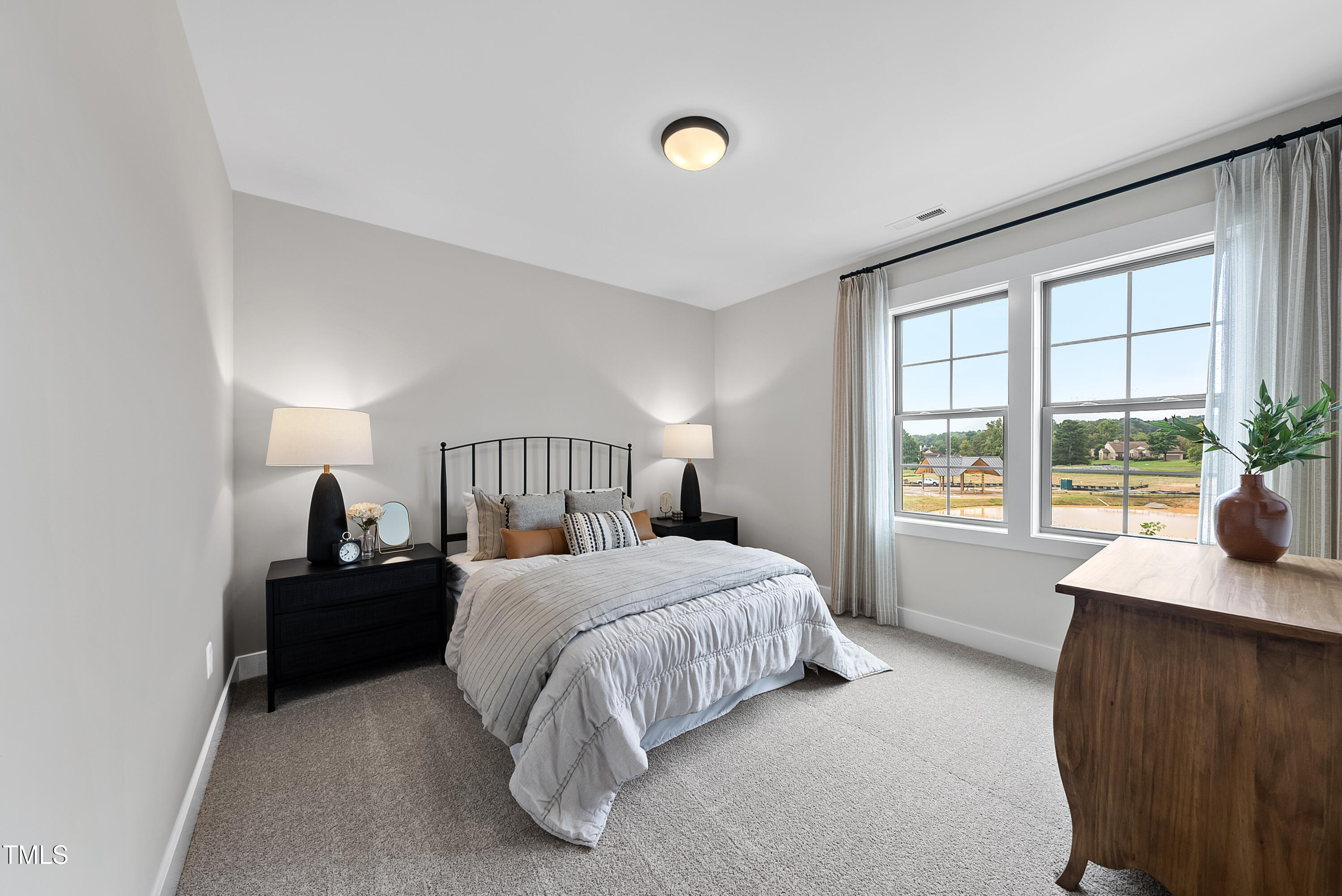 1049 Coldspring Circle Durham, NC 27705 - Photo 16 of 23 a bedroom with a bed and a window
