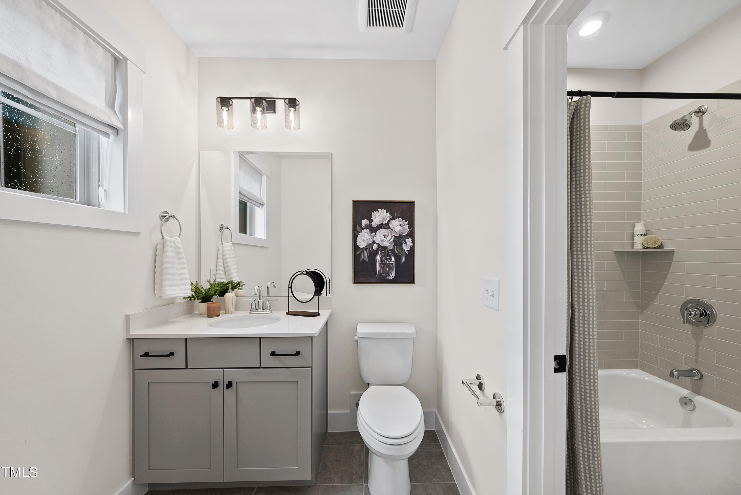 1049 Coldspring Circle Durham, NC 27705 - Photo 17 of 23 a bathroom with a sink toilet and shower