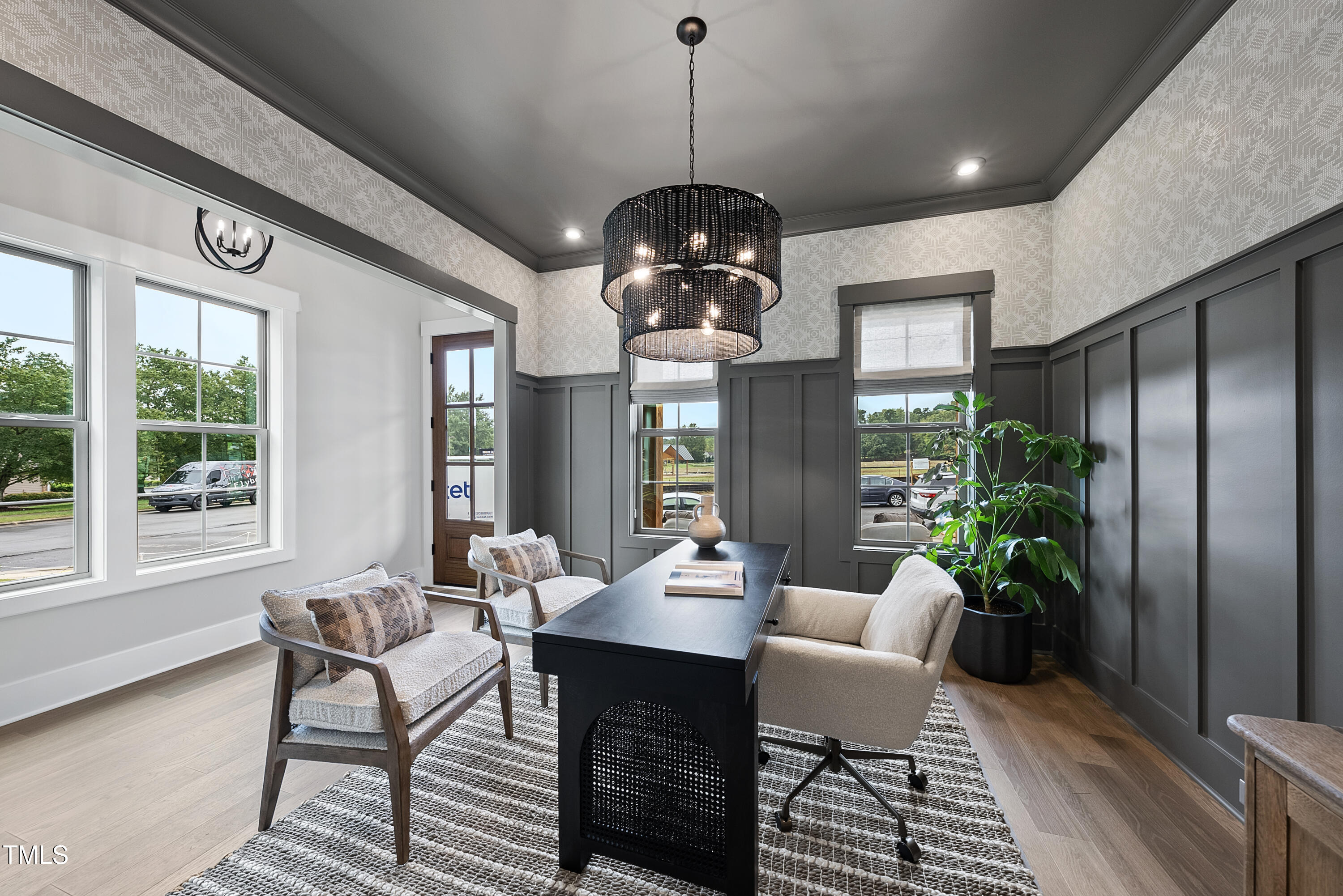 1049 Coldspring Circle Durham, NC 27705 - Photo 2 of 23 a dining room with furniture a chandelier and wooden floor