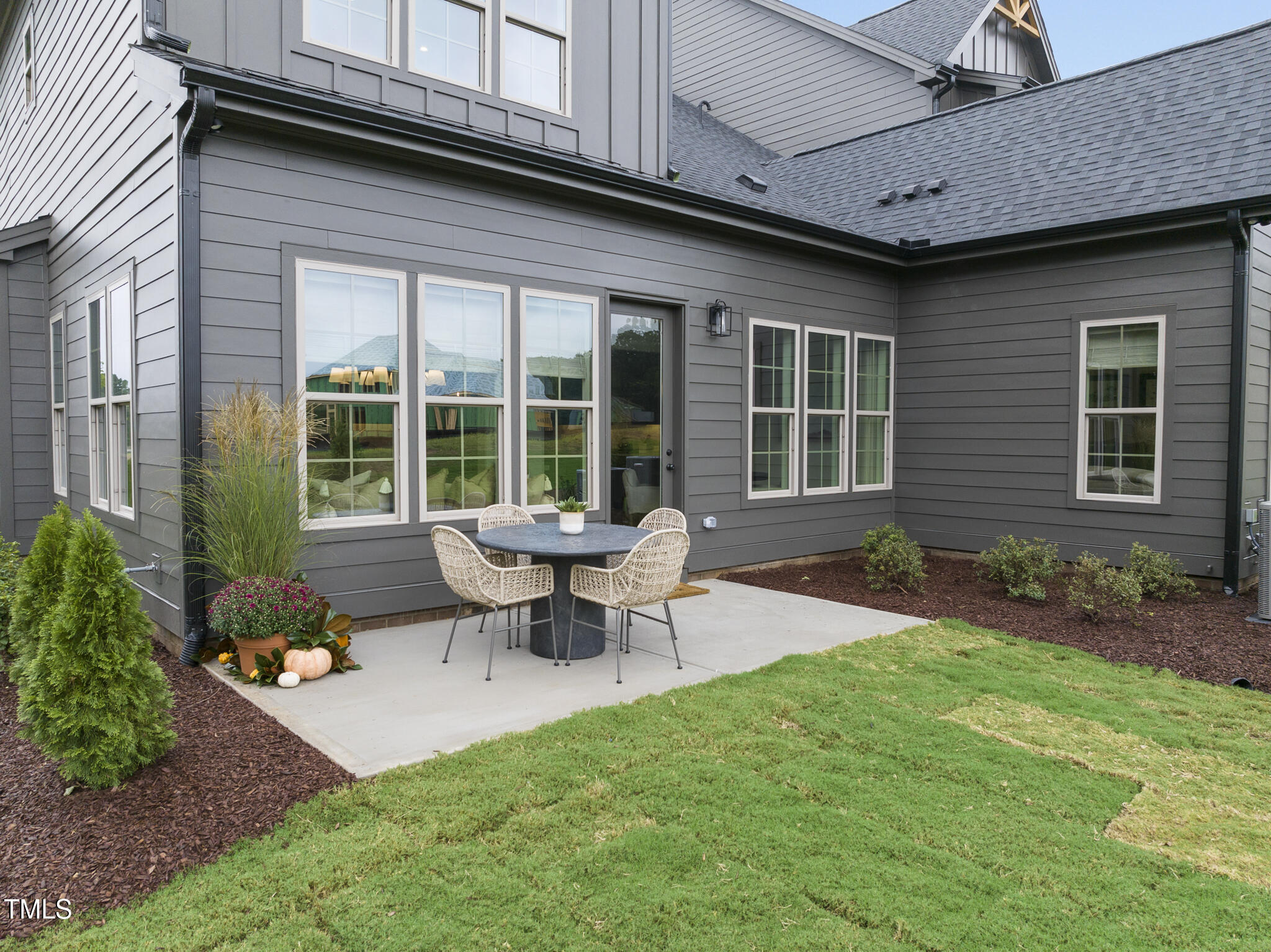 1049 Coldspring Circle Durham, NC 27705 - Photo 23 of 23 a view of a house with backyard sitting area and garden