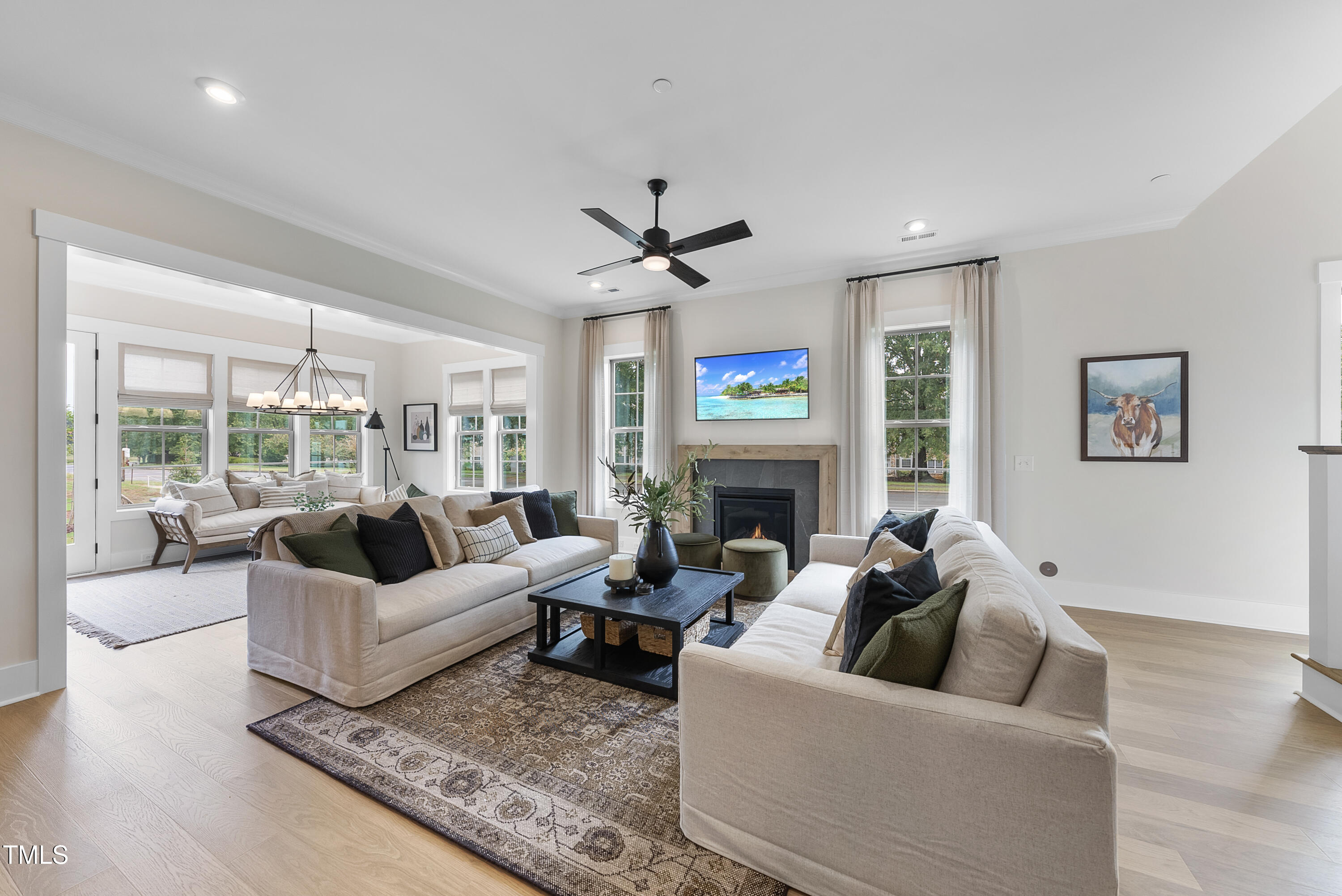 1049 Coldspring Circle Durham, NC 27705 - Photo 4 of 23 a living room with furniture fireplace and a large window