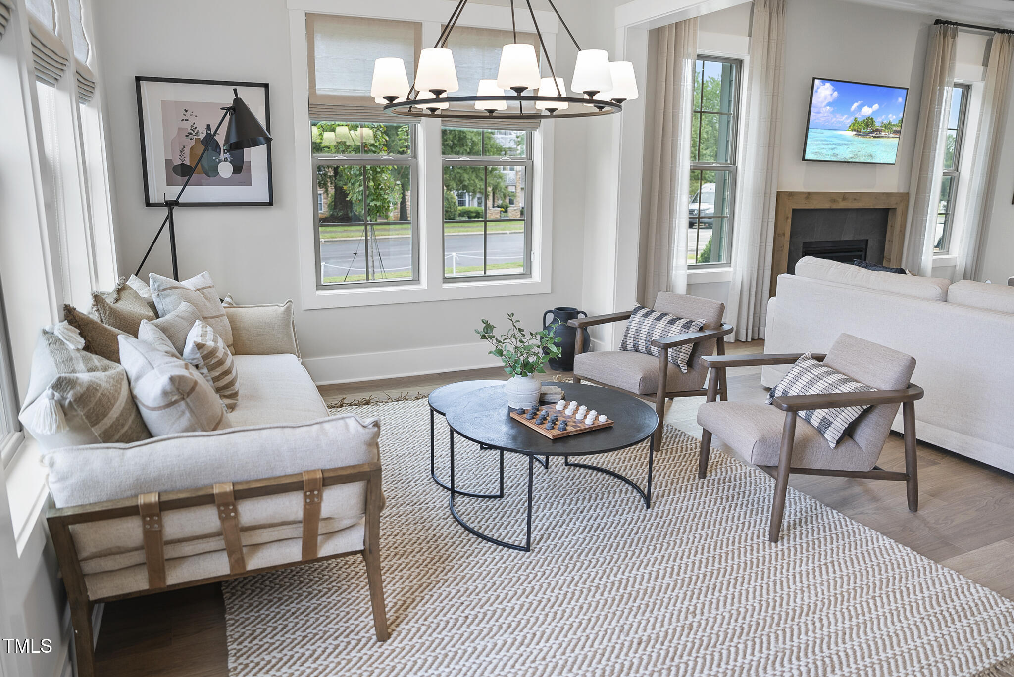 1049 Coldspring Circle Durham, NC 27705 - Photo 5 of 23 a living room with furniture a large window and a table