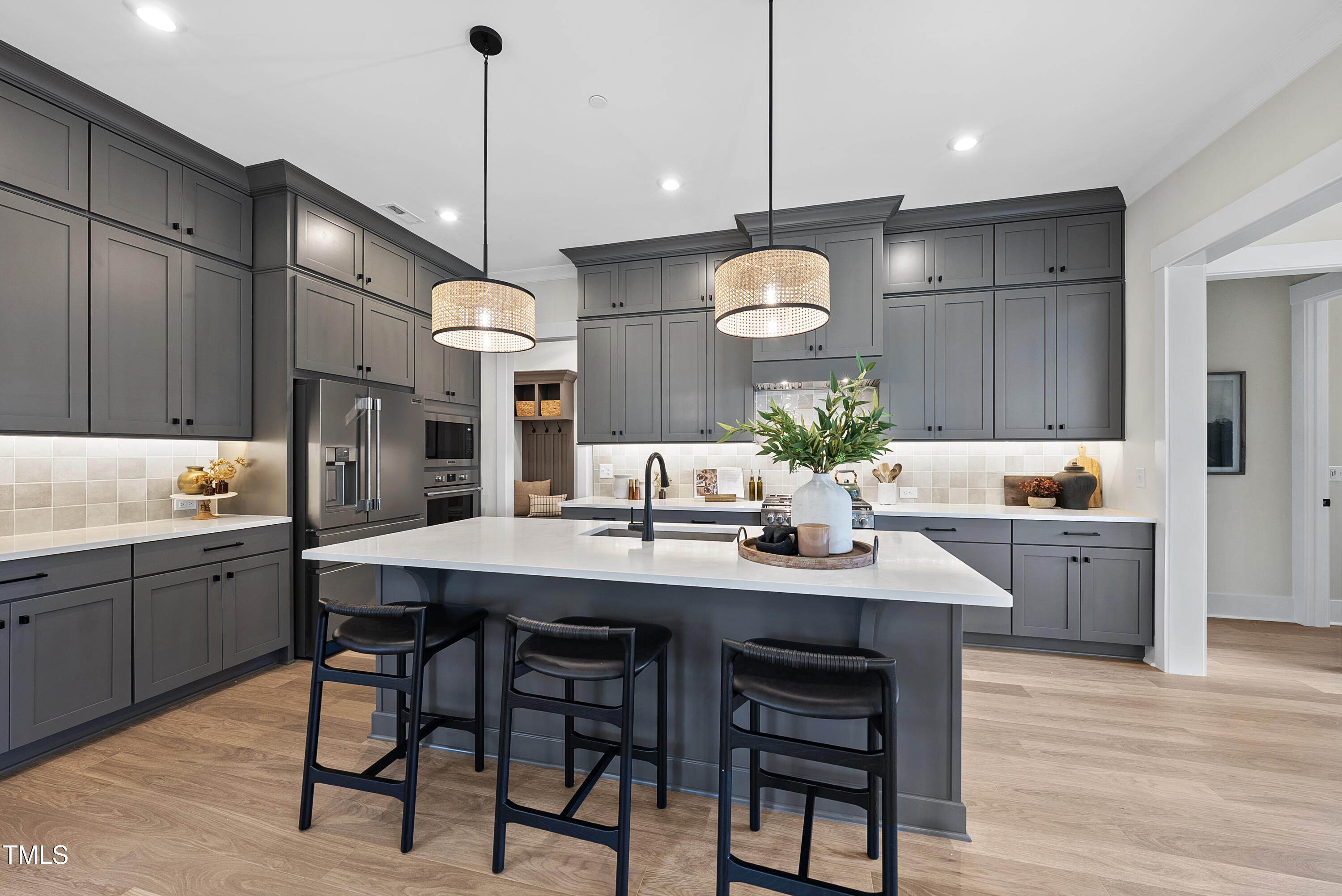 1049 Coldspring Circle Durham, NC 27705 - Photo 7 of 23 a kitchen with a table chairs sink and cabinets
