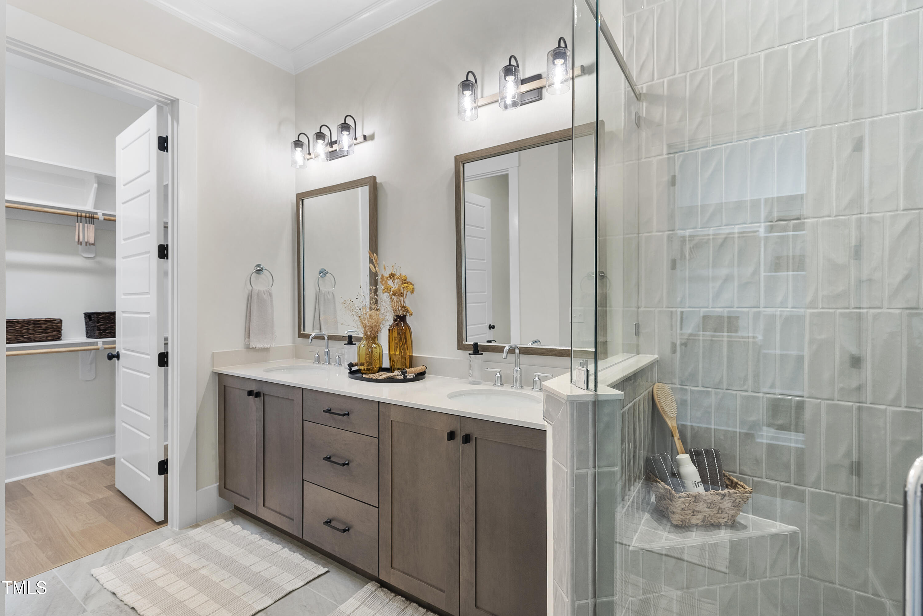 1049 Coldspring Circle Durham, NC 27705 - Photo 10 of 23 a bathroom with a double vanity sink and a mirror