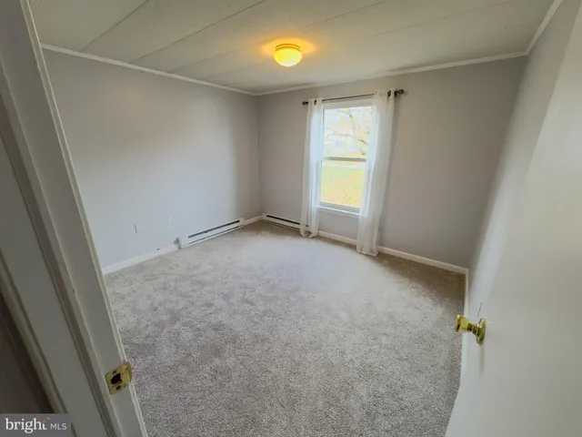 a bathroom with a sink a mirror and a shower