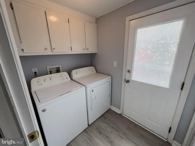 a view of balcony with wooden floor and fence