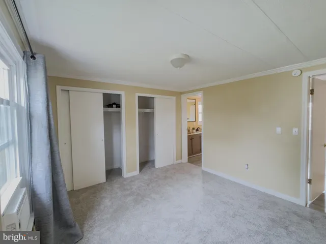 a bathroom with a tub sink double vanity granite tub and shower