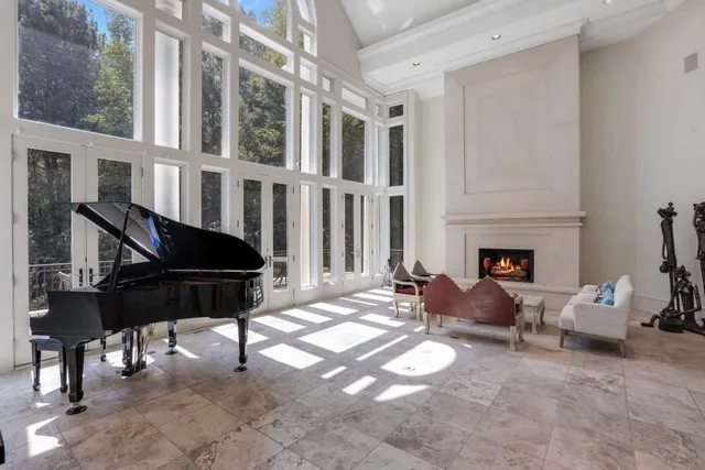 a room with pool table and a fireplace