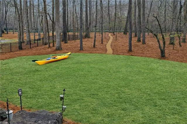 a view of balcony with wooden floor and outdoor seating