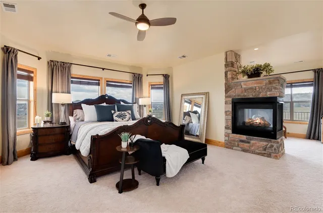 a bedroom with a bed and a fireplace