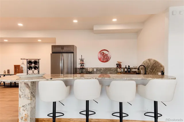 a view of a kitchen with dining table and chairs