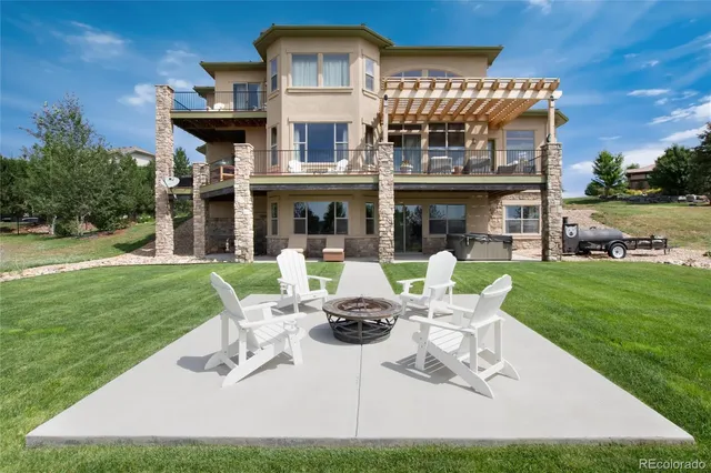 a front view of a house with garden and porch