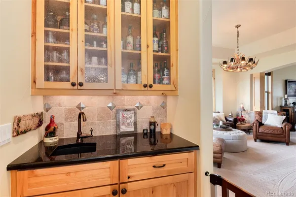 a kitchen with sink and cabinets